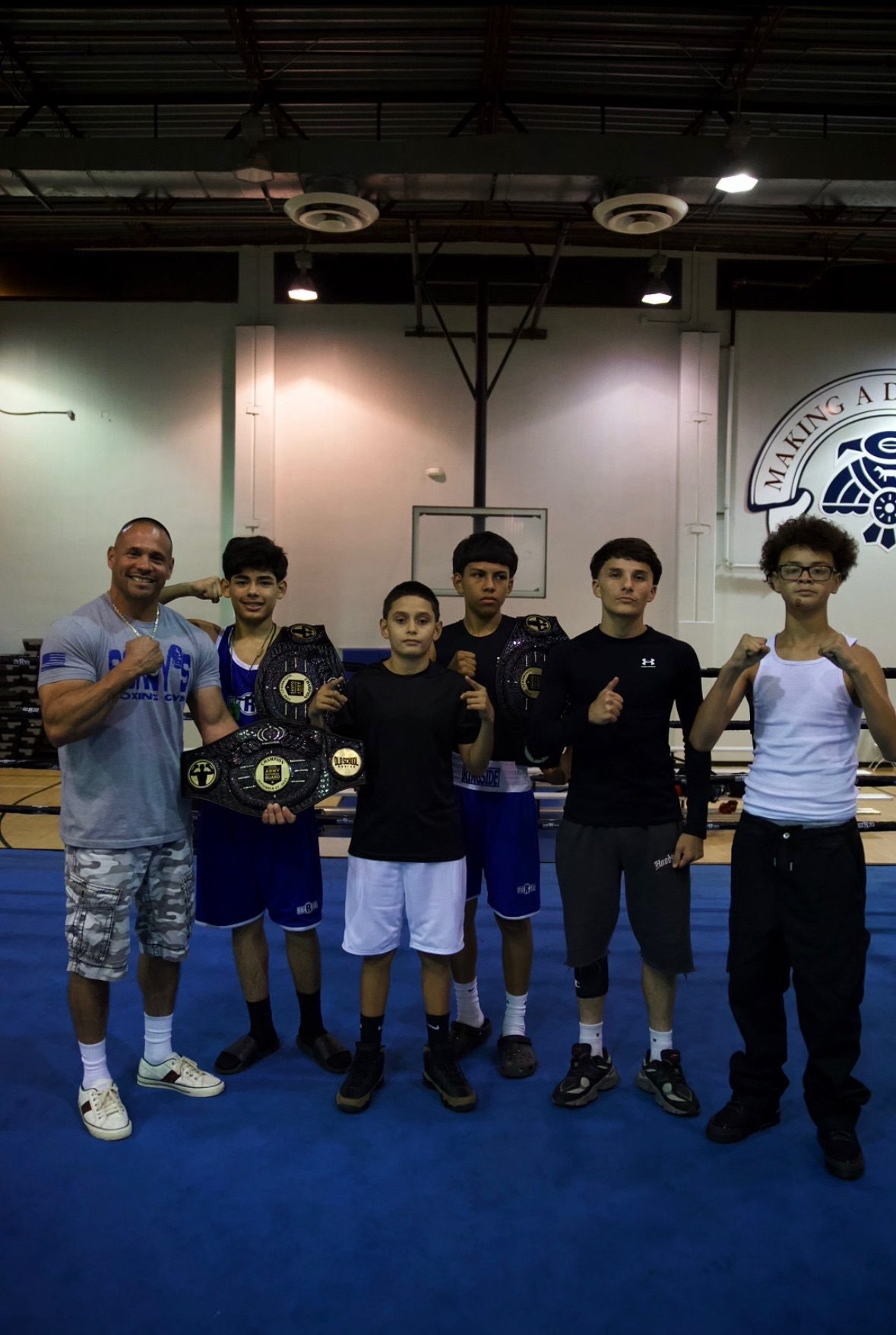 Young Old School Boxing Club fighters with championship belts
