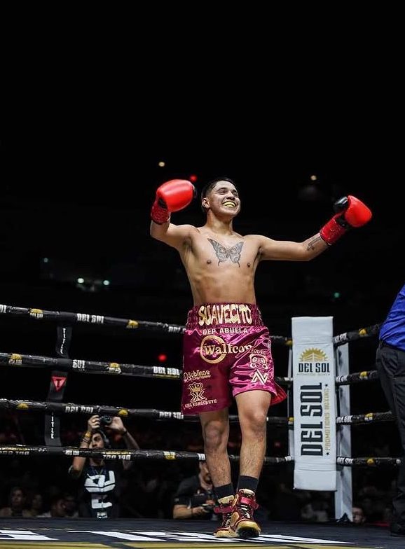 Old School Boxing Club fighter celebrating a win