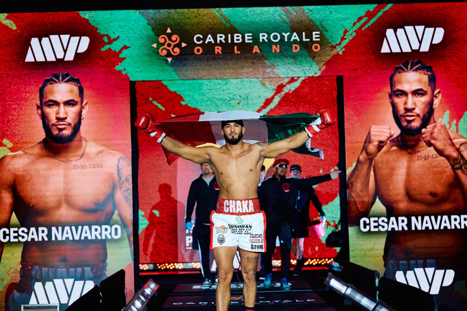 Old School Boxing Club fighter walking out to the ring carrying the Mexican flag