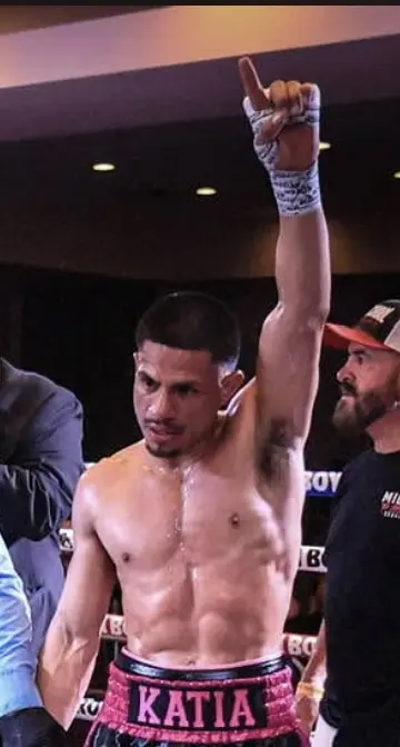 Miguel El Suavecito Ceballos raising his hand after his last fight